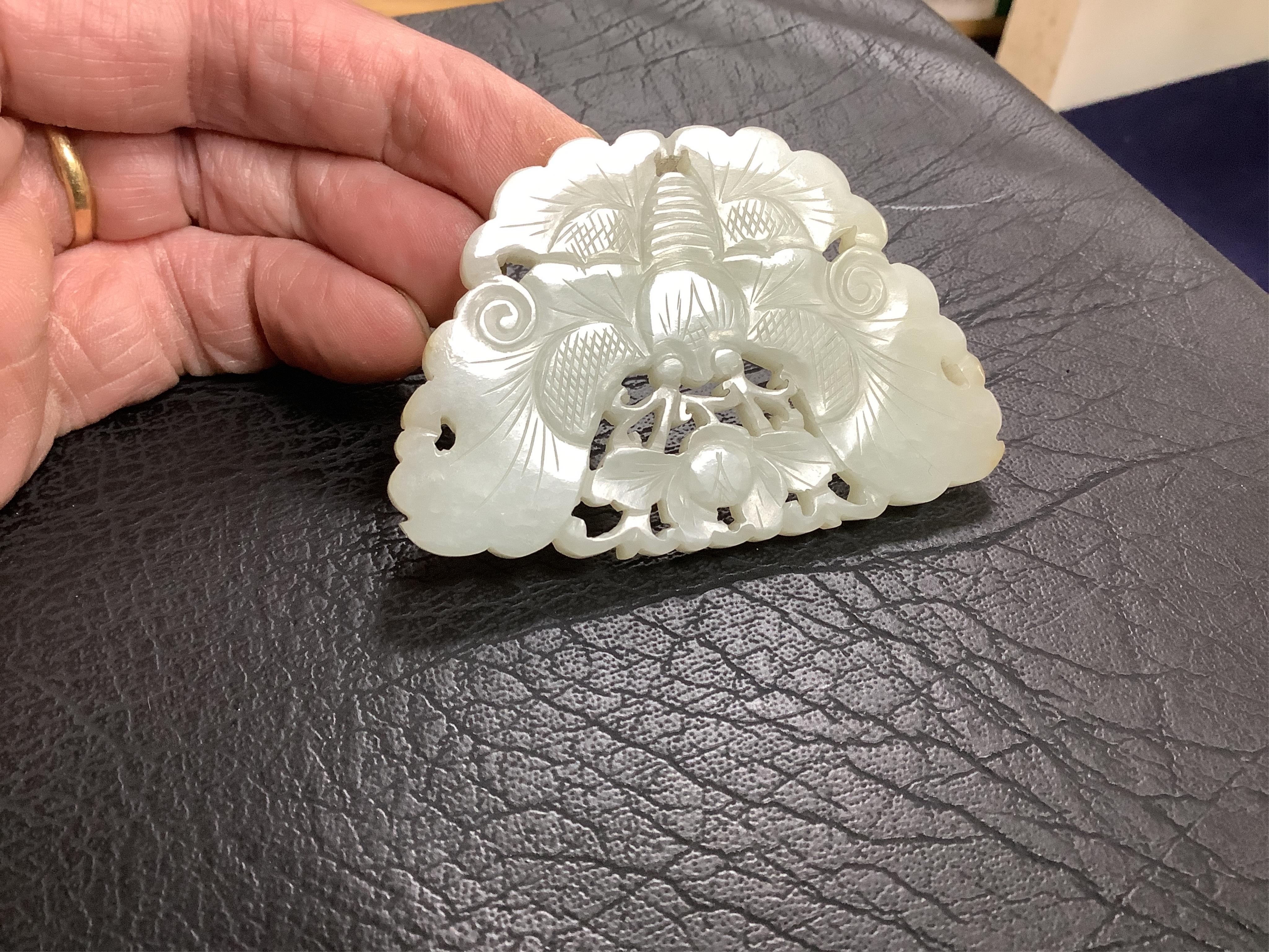 A Chinese reticulated jade ‘butterfly’ plaque , late Qing dynasty, 7cm wide. Condition - good